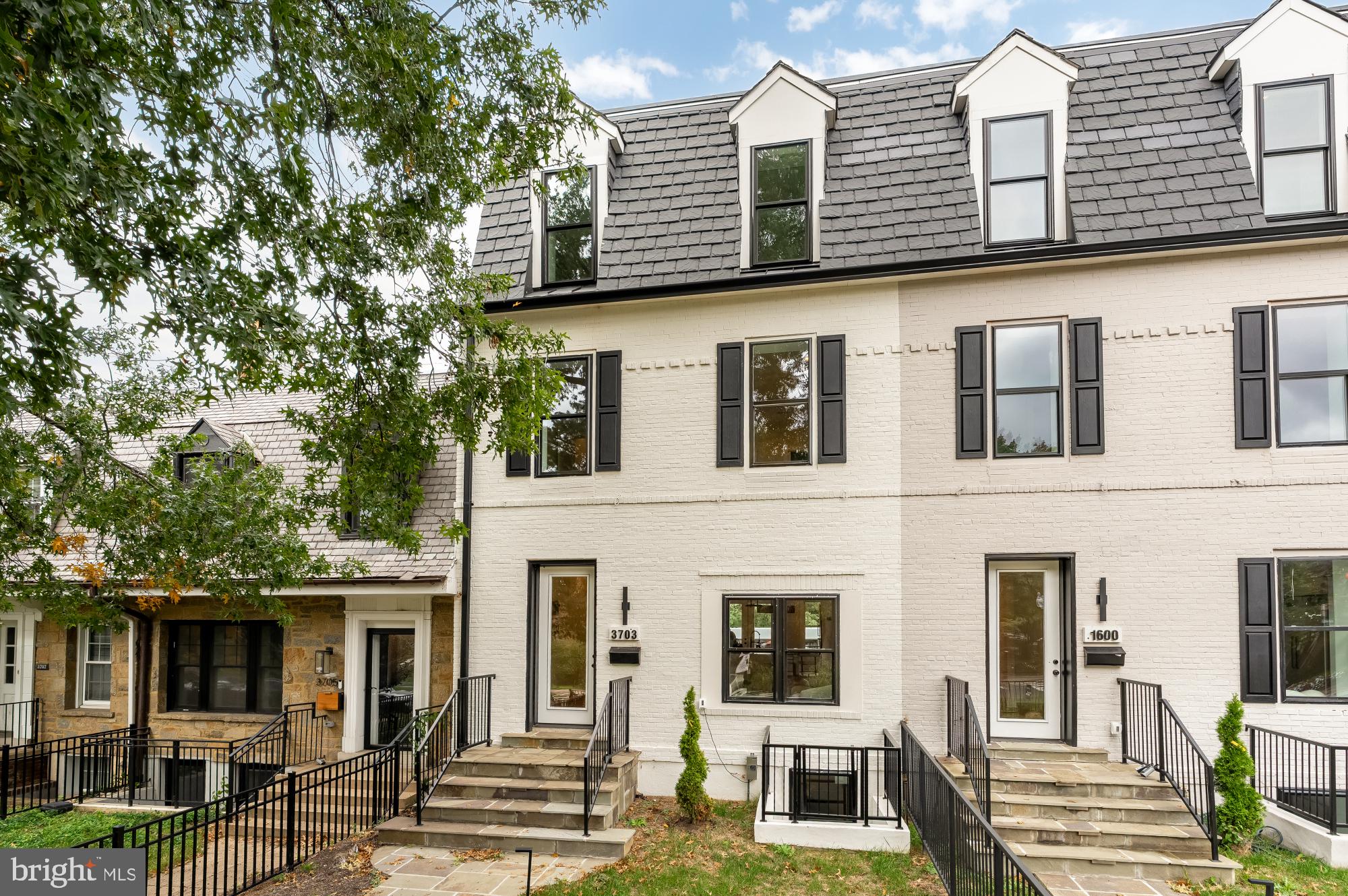 3703 Reservoir Road Northwest Washington, DC 20007 - Photo 2 of 60 a front view of a residential apartment building with a yard