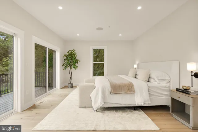 a view of a bedroom with furniture and rug