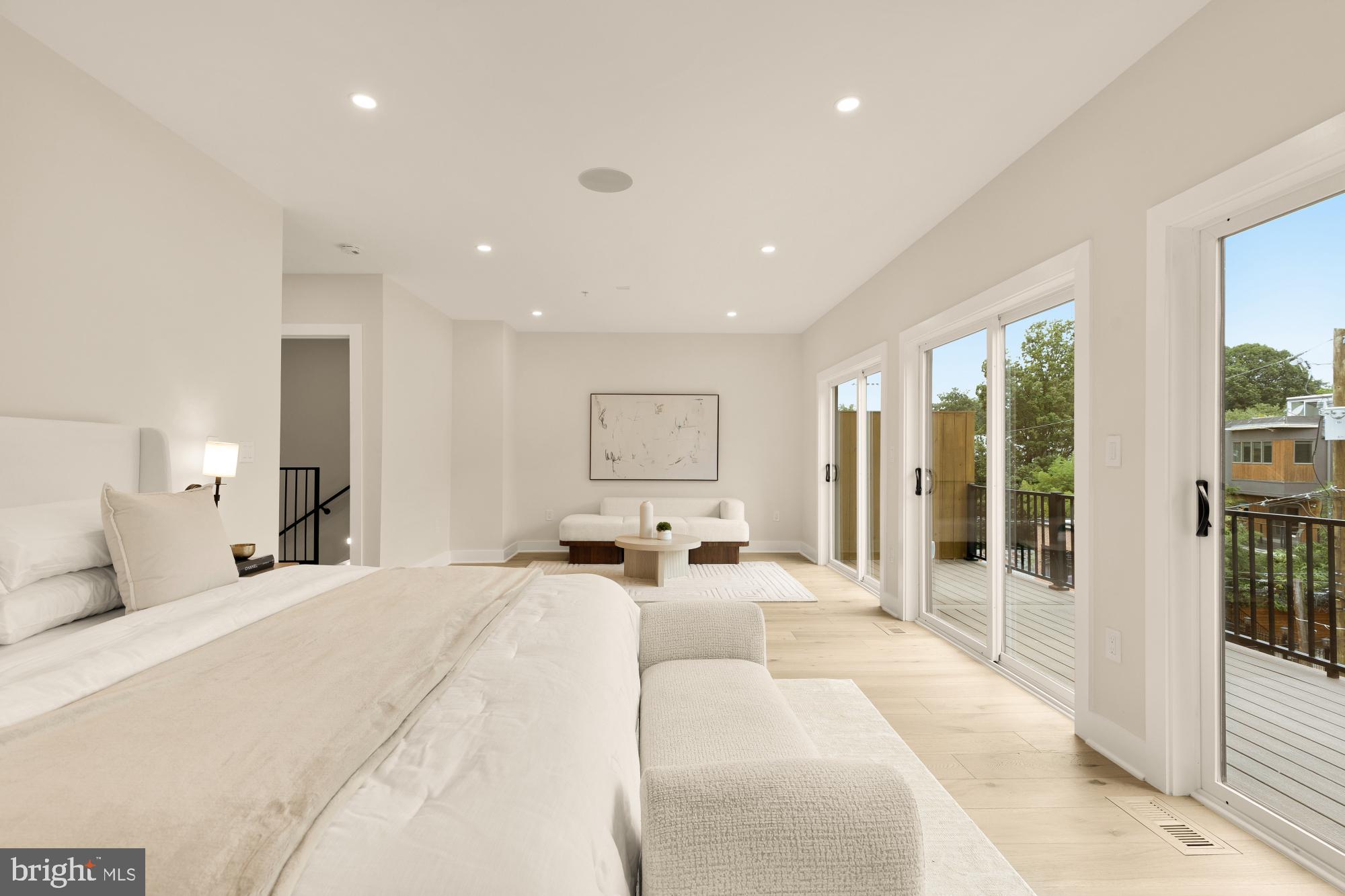 3703 Reservoir Road Northwest Washington, DC 20007 - Photo 28 of 60 a spacious bedroom with a large bed and a large window