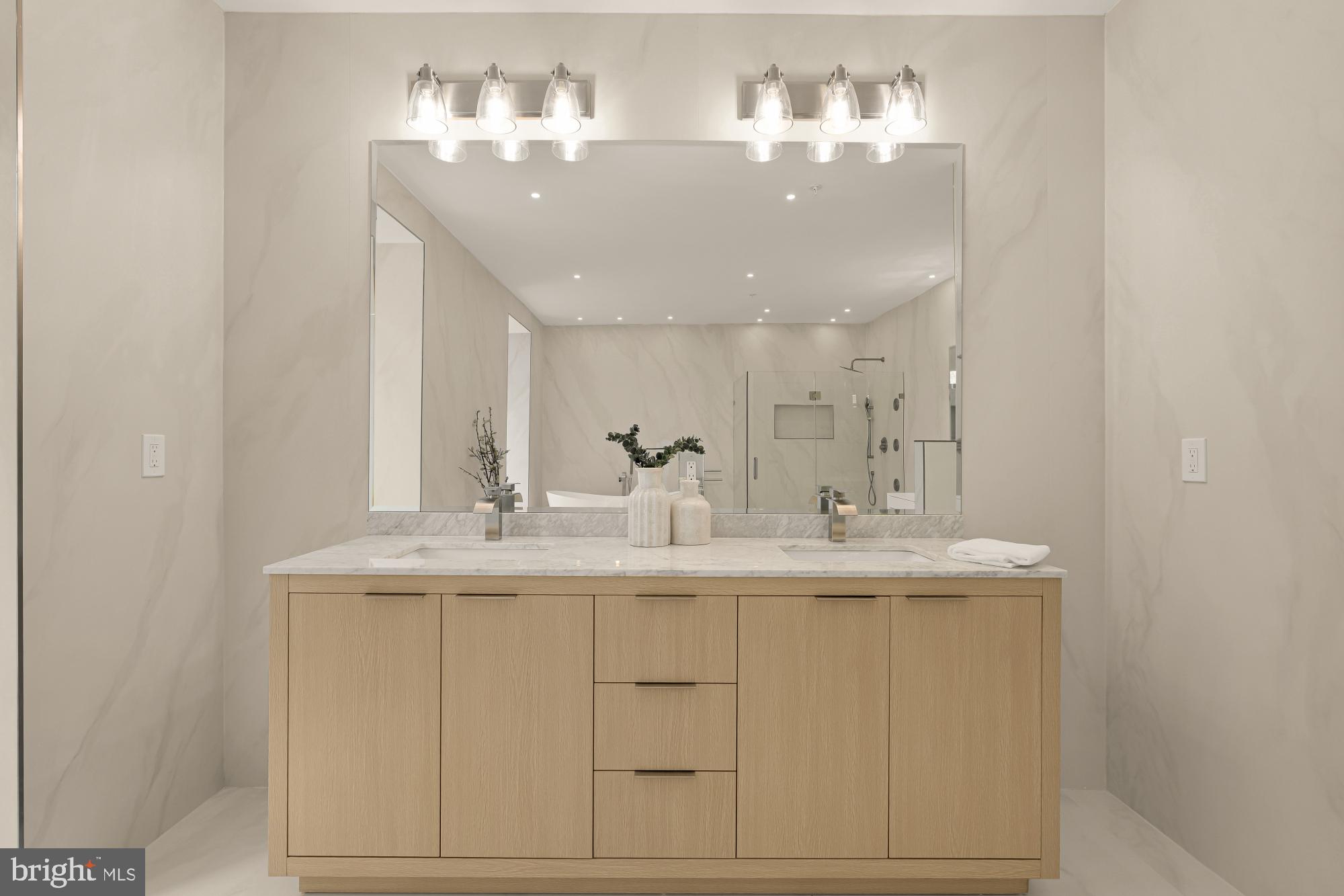 3703 Reservoir Road Northwest Washington, DC 20007 - Photo 32 of 60 a bathroom with a sink vanity and mirror