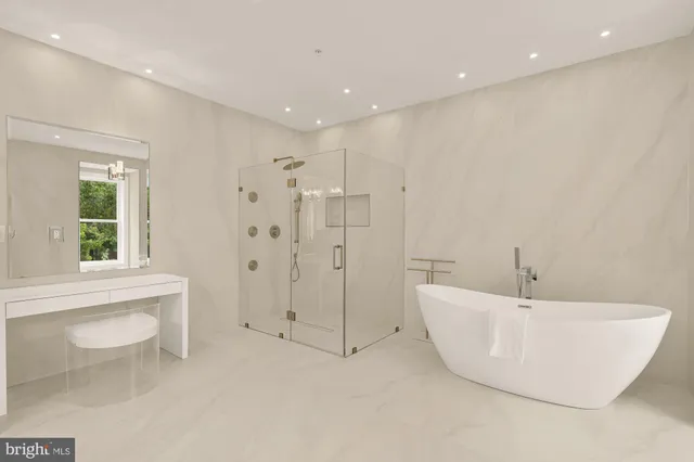 a large white bed in a white room