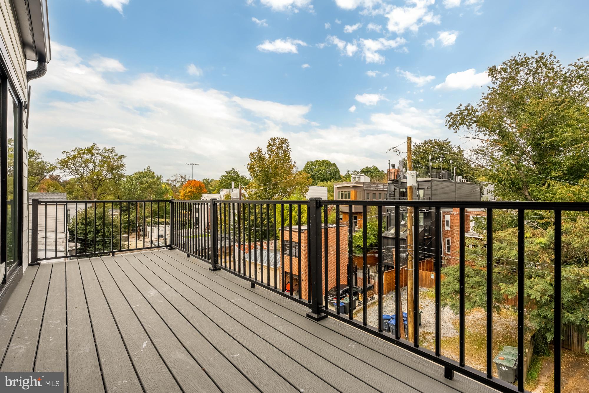 3703 Reservoir Road Northwest Washington, DC 20007 - Photo 37 of 60 a balcony with wooden floor and fence