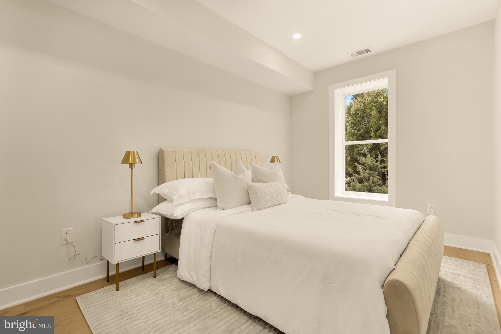 3703 Reservoir Road Northwest Washington, DC 20007 - Photo 40 of 60 a bedroom with a bed and a window