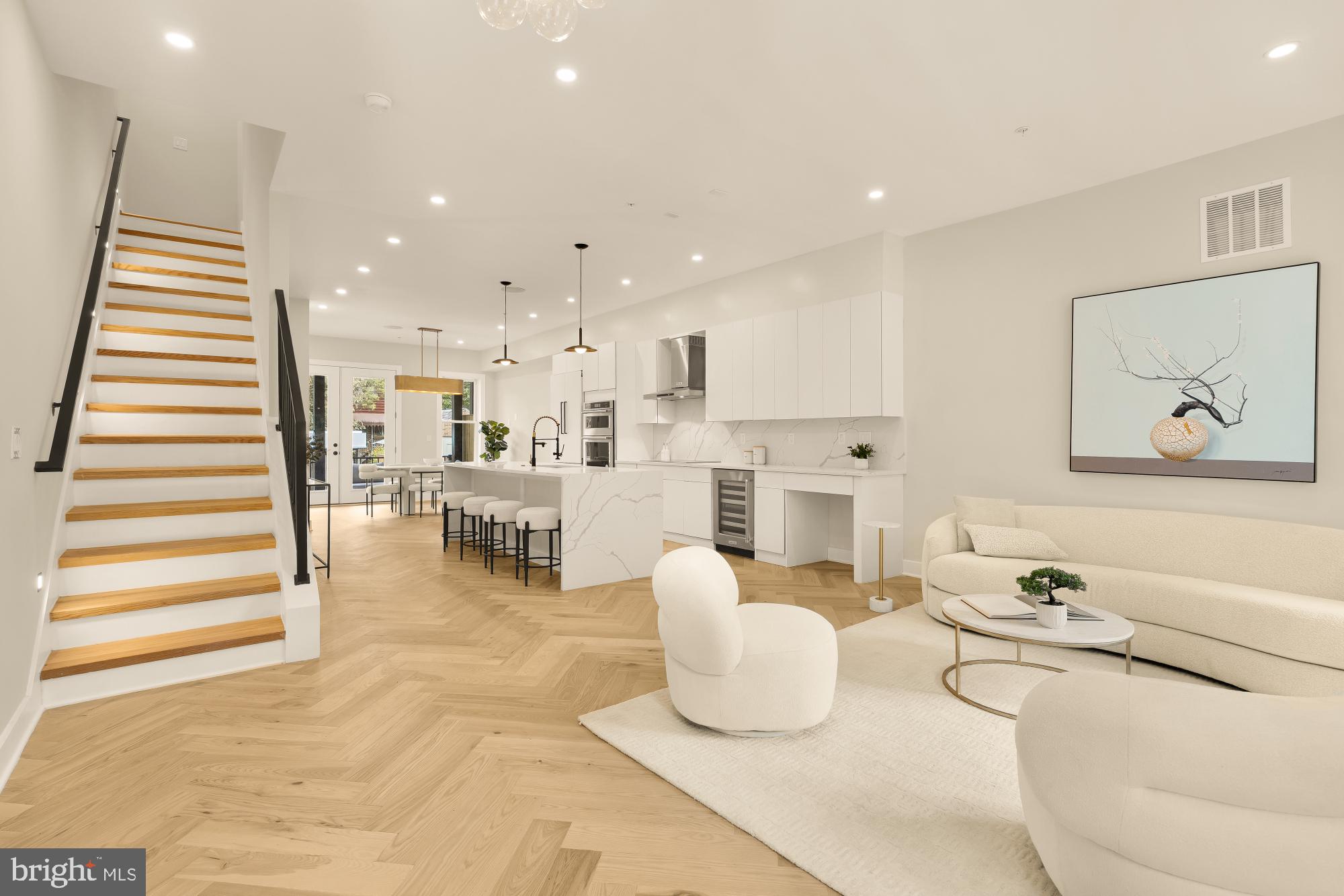 3703 Reservoir Road Northwest Washington, DC 20007 - Photo 4 of 60 a living room with stainless steel appliances kitchen island furniture and a view of kitchen
