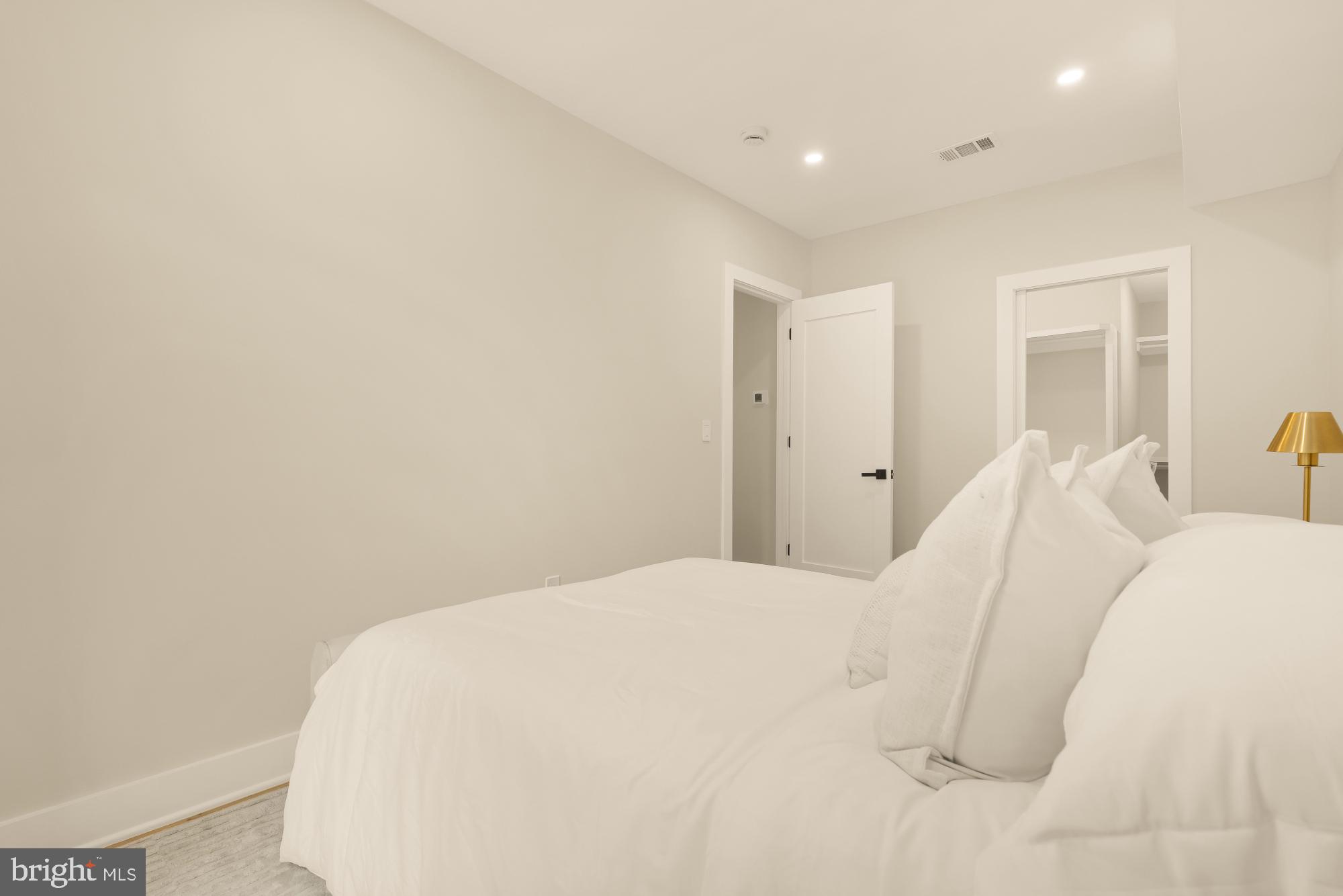 3703 Reservoir Road Northwest Washington, DC 20007 - Photo 41 of 60 a large white bed in a white room