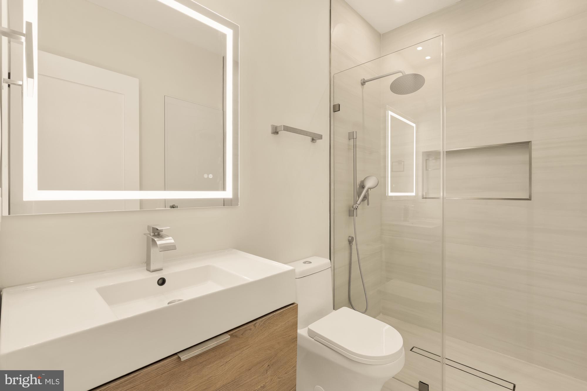 3703 Reservoir Road Northwest Washington, DC 20007 - Photo 43 of 60 a bathroom with a sink a toilet and shower