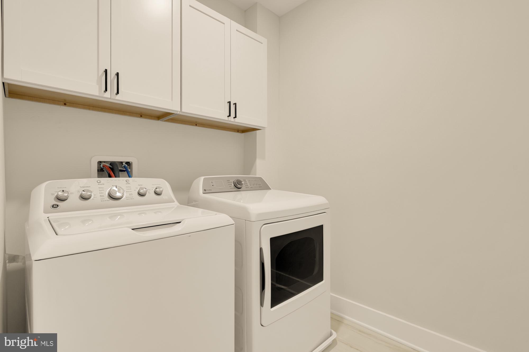 3703 Reservoir Road Northwest Washington, DC 20007 - Photo 45 of 60 a utility room with dryer and washer