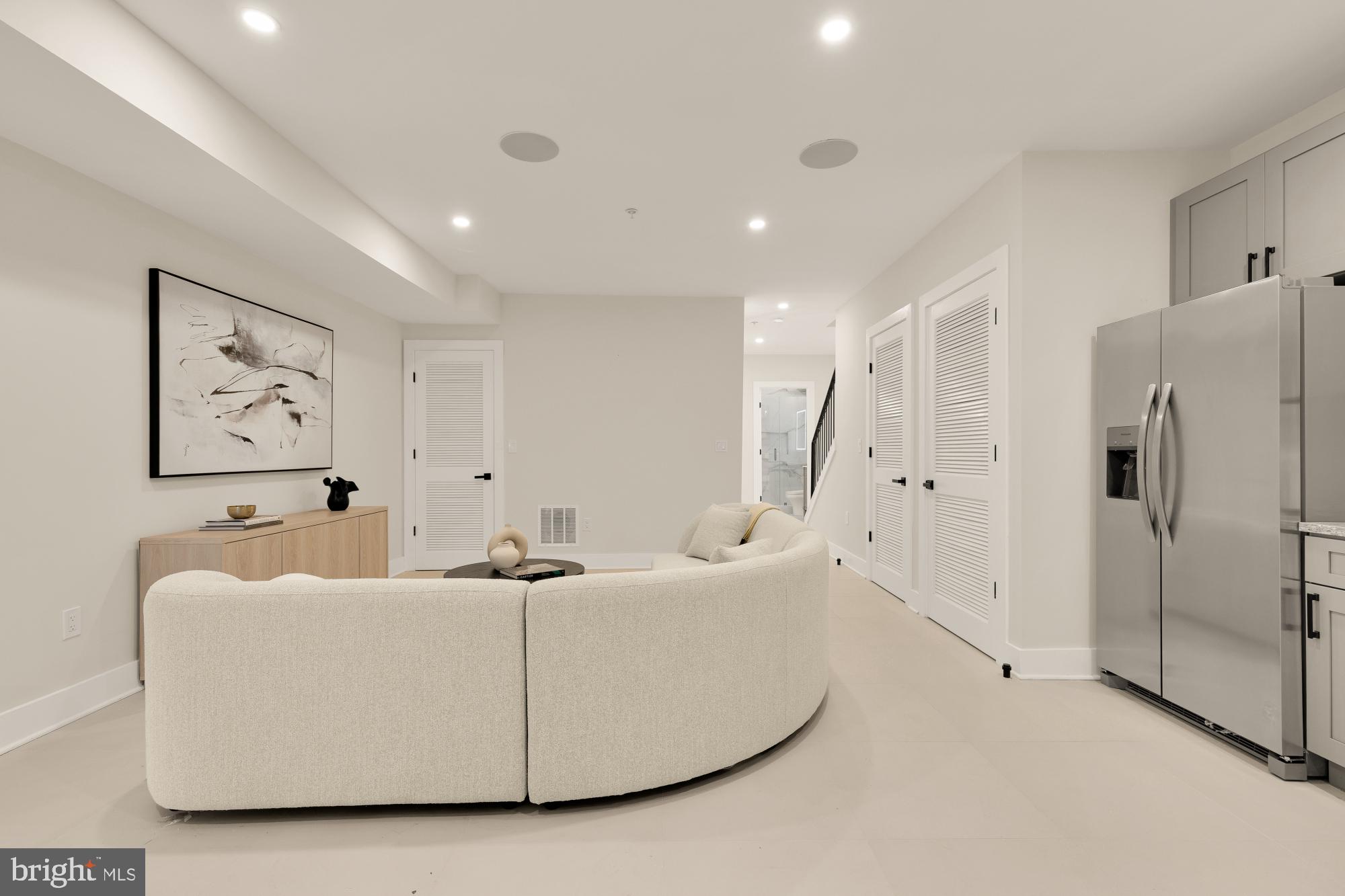 3703 Reservoir Road Northwest Washington, DC 20007 - Photo 50 of 60 a living room with furniture and a refrigerator
