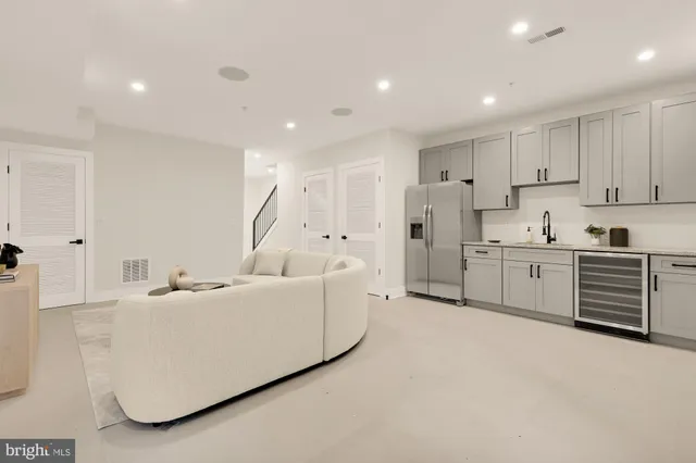 a picture of a room with a white wall and a large window