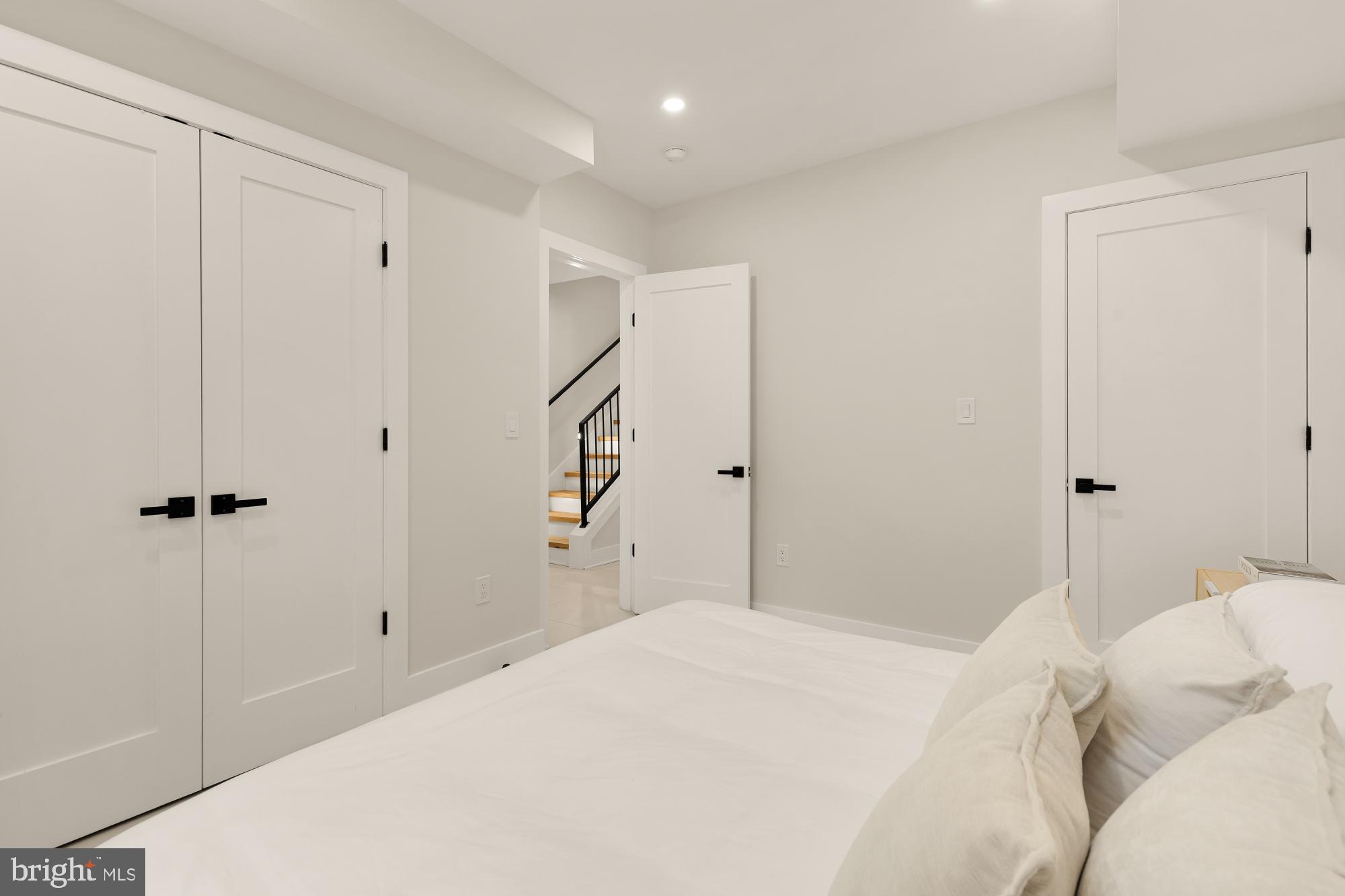 3703 Reservoir Road Northwest Washington, DC 20007 - Photo 57 of 60 a bedroom with a bed and a closet