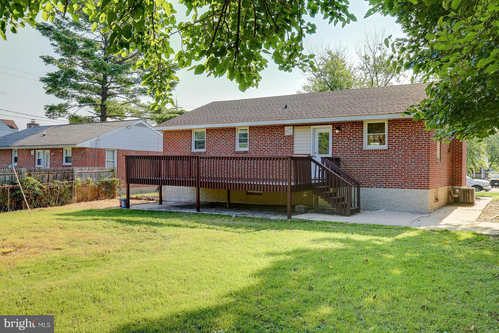 3216 Mayfair Road Baltimore, MD 21207 - Photo 23 of 24 a view of a house with a yard and a large tree