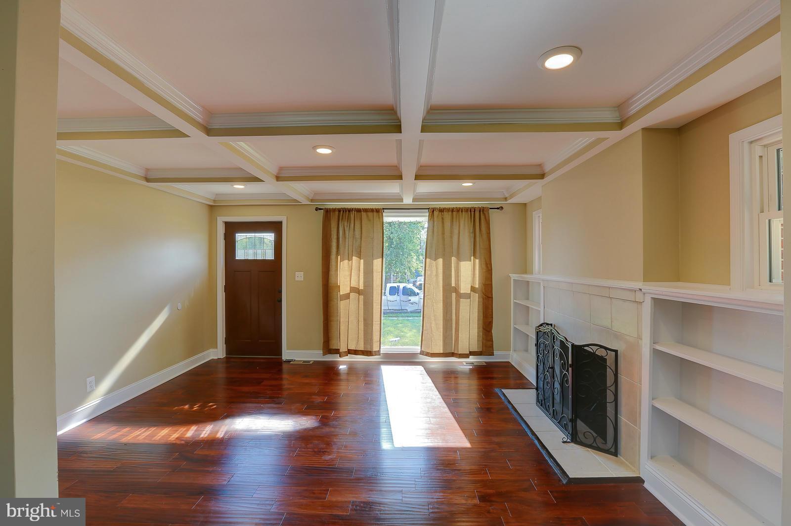 3216 Mayfair Road Baltimore, MD 21207 - Photo 4 of 24 a view of entryway with wooden floor and staircase