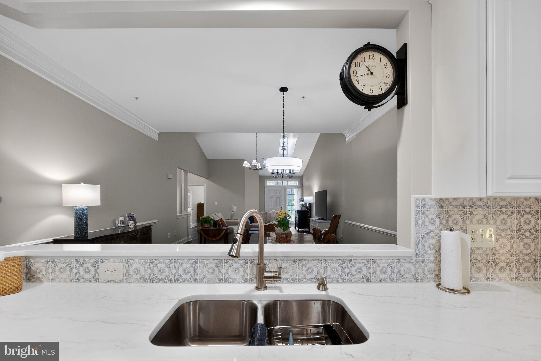 330 Colony Point Place Edgewater, MD 21037 - Photo 21 of 57 a kitchen with a sink and a mirror
