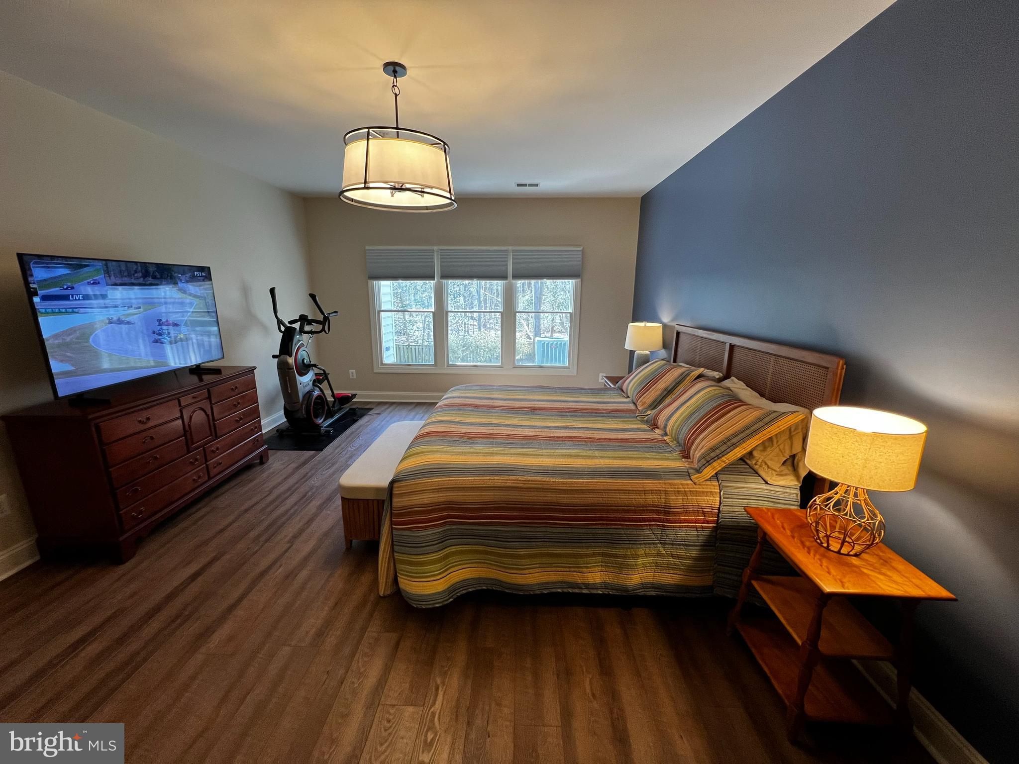 330 Colony Point Place Edgewater, MD 21037 - Photo 32 of 57 a spacious bedroom with a bed dresser and a window