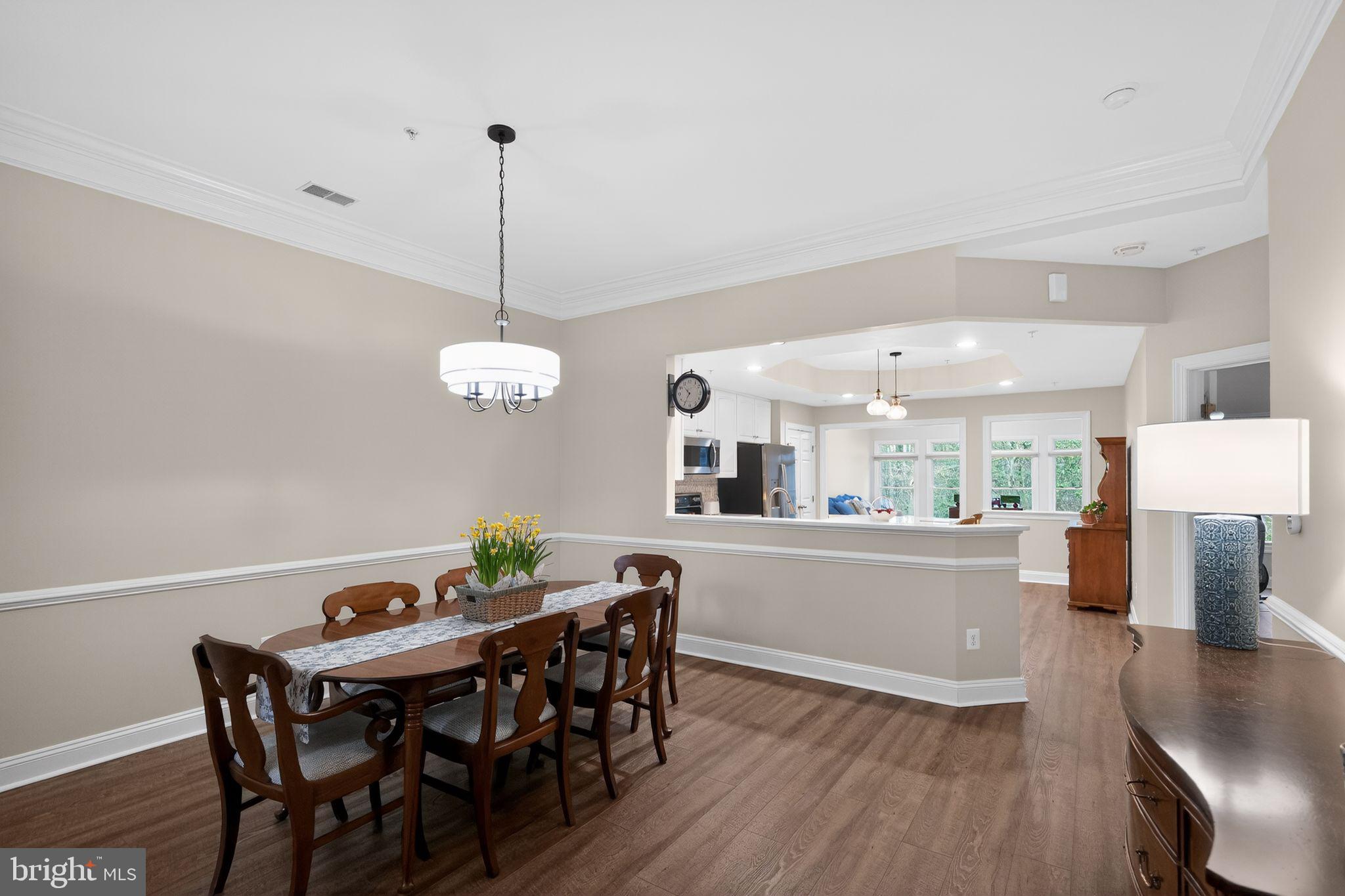 330 Colony Point Place Edgewater, MD 21037 - Photo 33 of 57 a dining room with furniture a chandelier and wooden floor