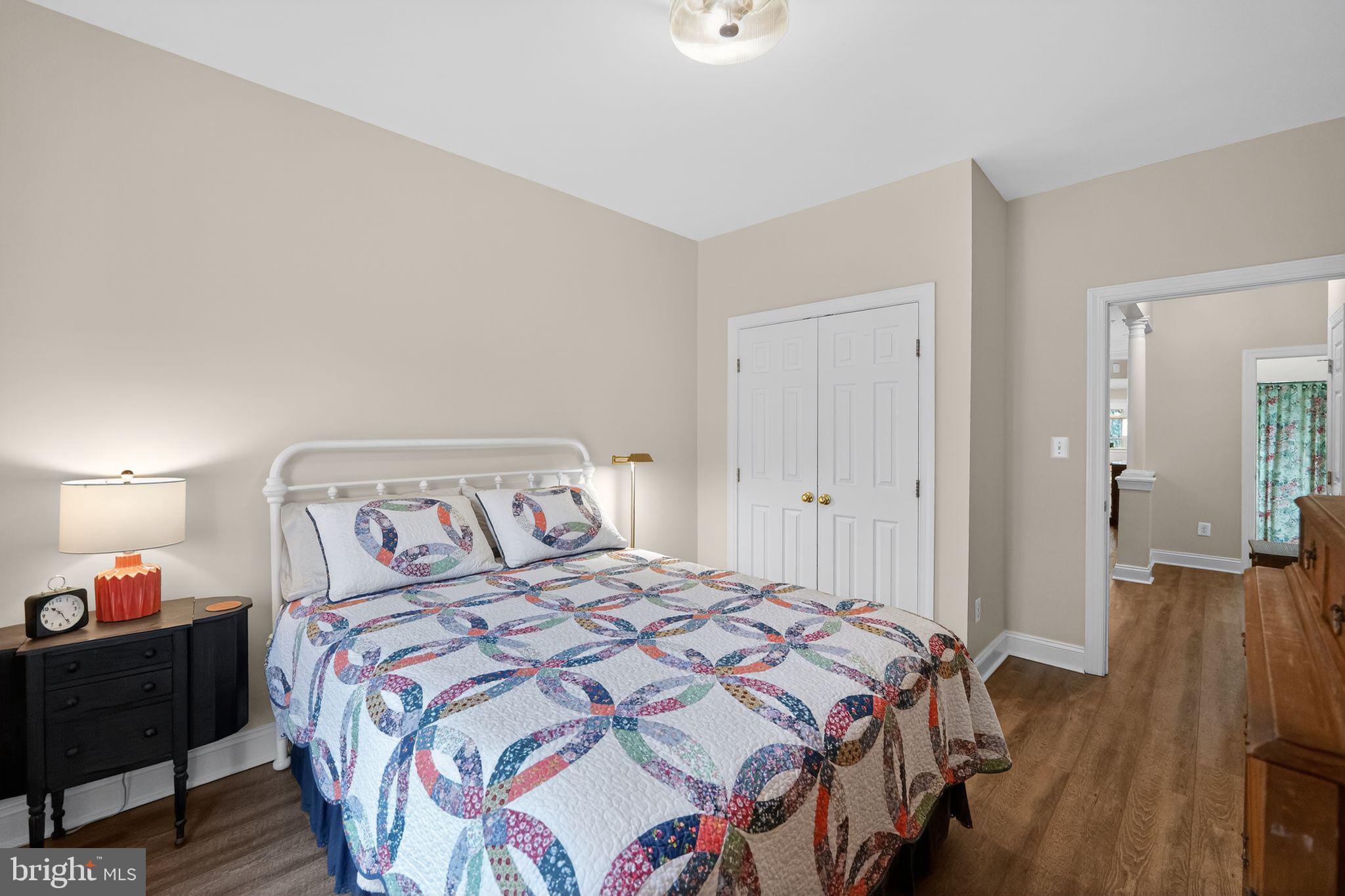330 Colony Point Place Edgewater, MD 21037 - Photo 41 of 57 a bedroom with a bed and wooden floor