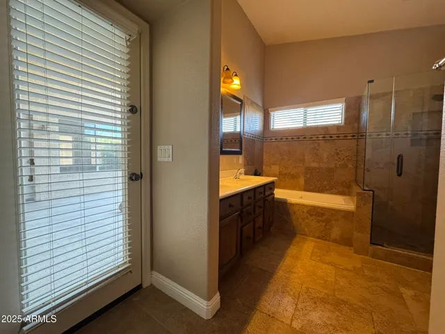 a bathroom with a sink and a shower
