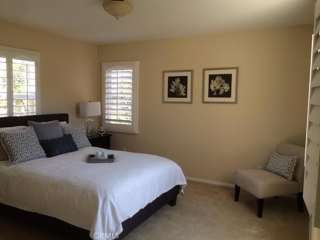 122 Reunion Irvine, CA 92603 - Photo 7 of 13 a bedroom with a bed and a couch