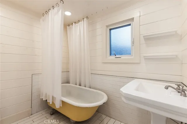 a bathroom with a sink and a bathtub