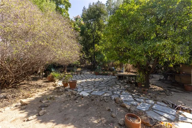 a view of backyard with outdoor seating