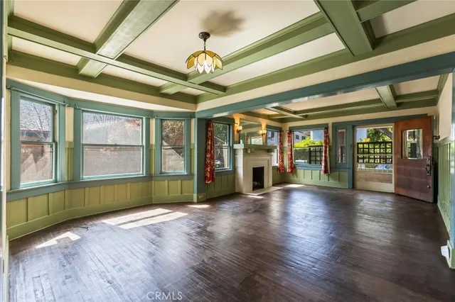 a view of livingroom with furniture wooden floor and fan