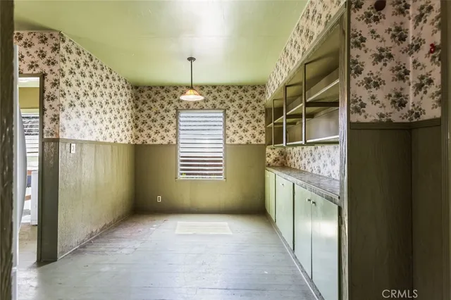 a view of an empty room with a fireplace