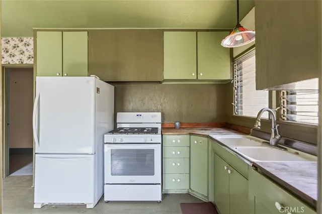 a storage room with wooden floor washer and dryer
