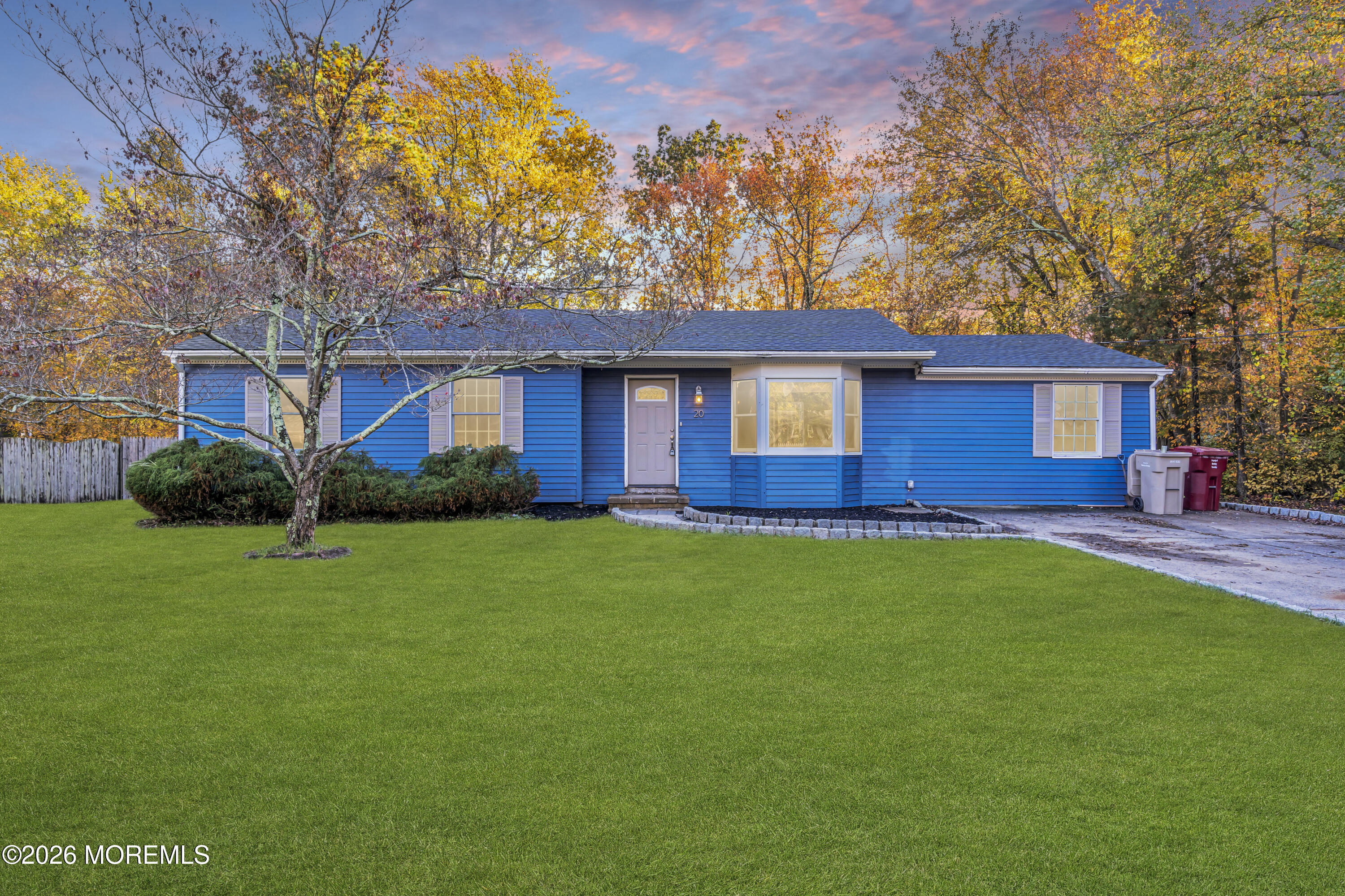 a view of a house with a backyard