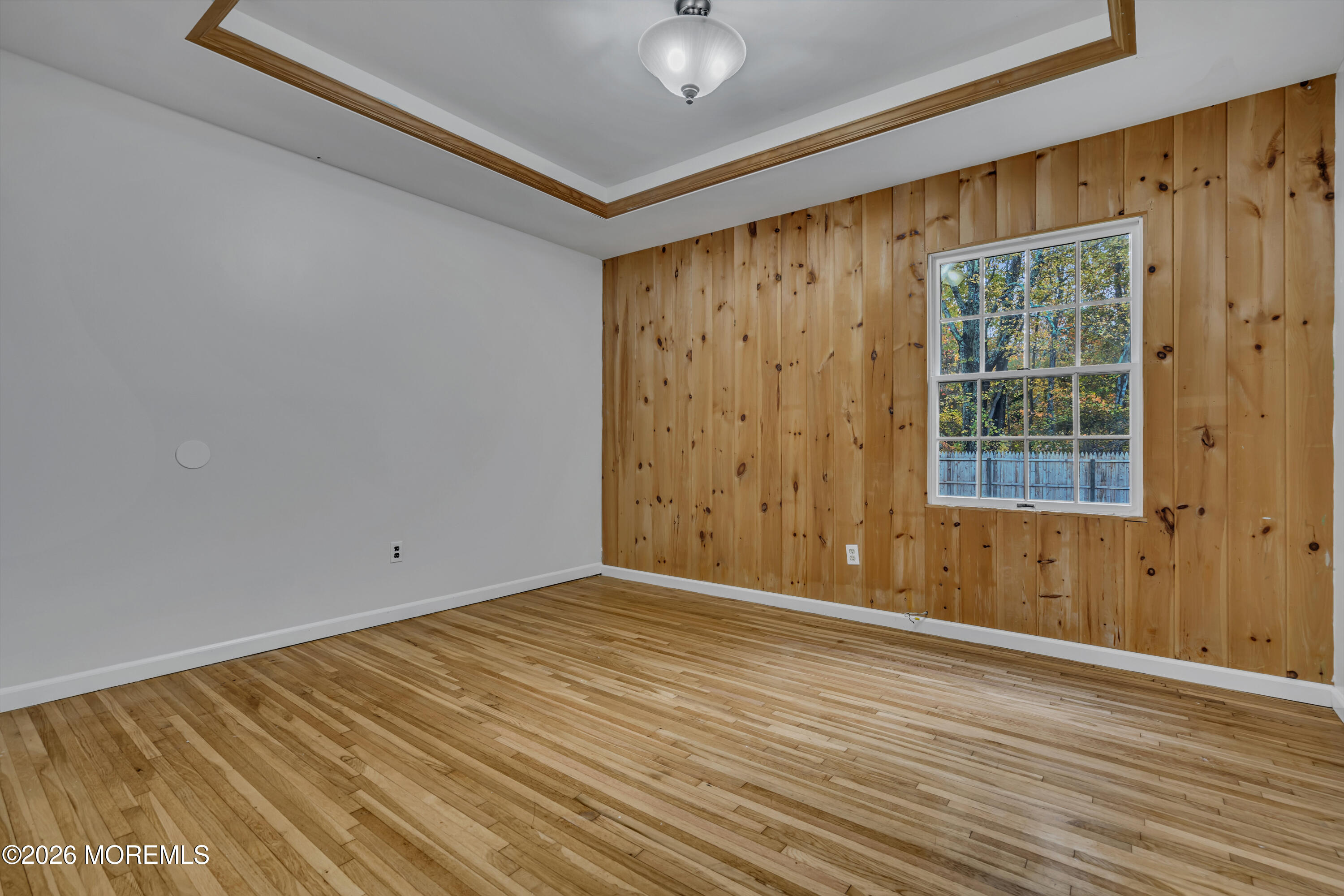 20 Jeanette Street Bayville, NJ 08721 - Photo 14 of 28 a view of an empty room with wooden floor and a window