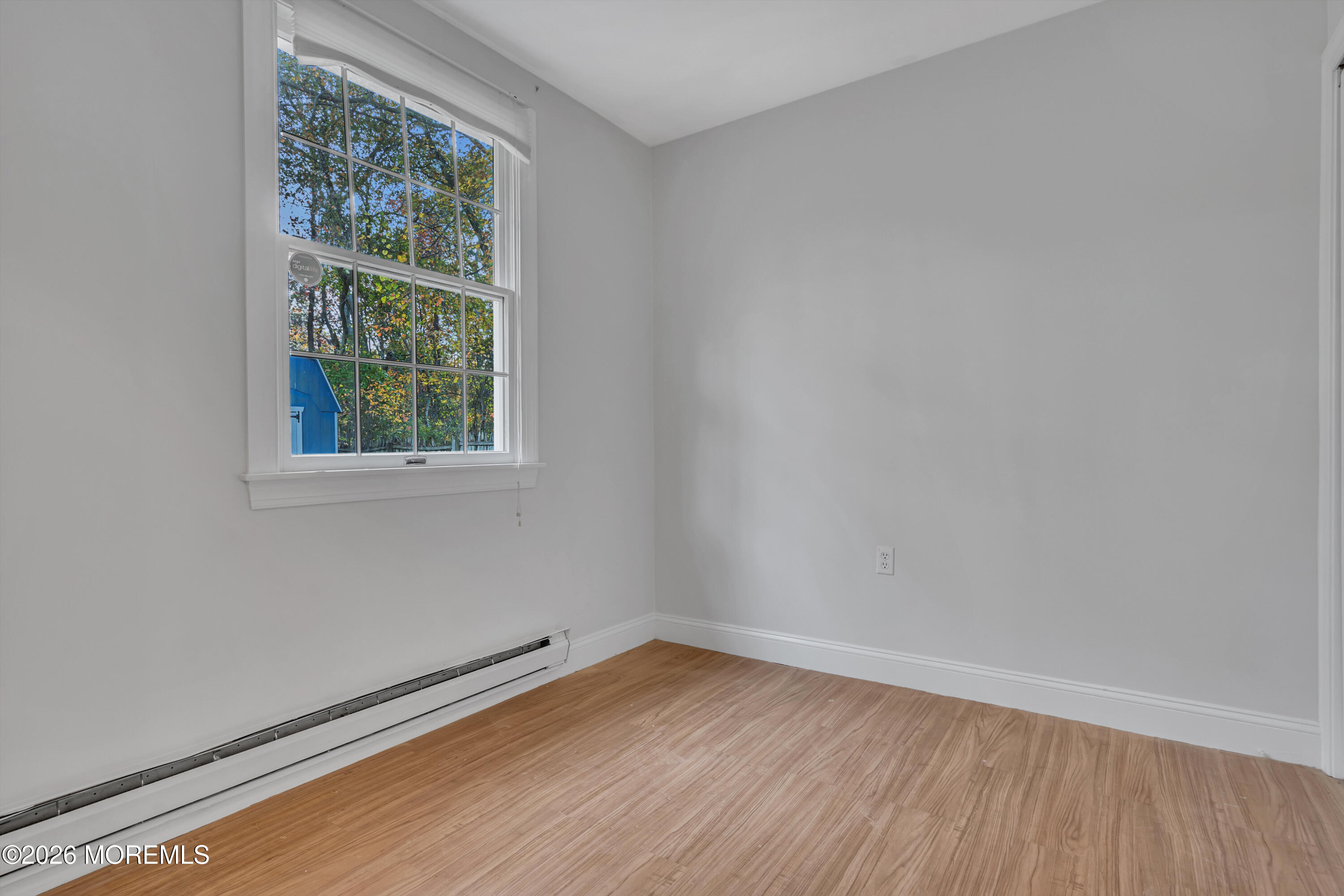 20 Jeanette Street Bayville, NJ 08721 - Photo 16 of 28 an empty room with wooden floor and windows