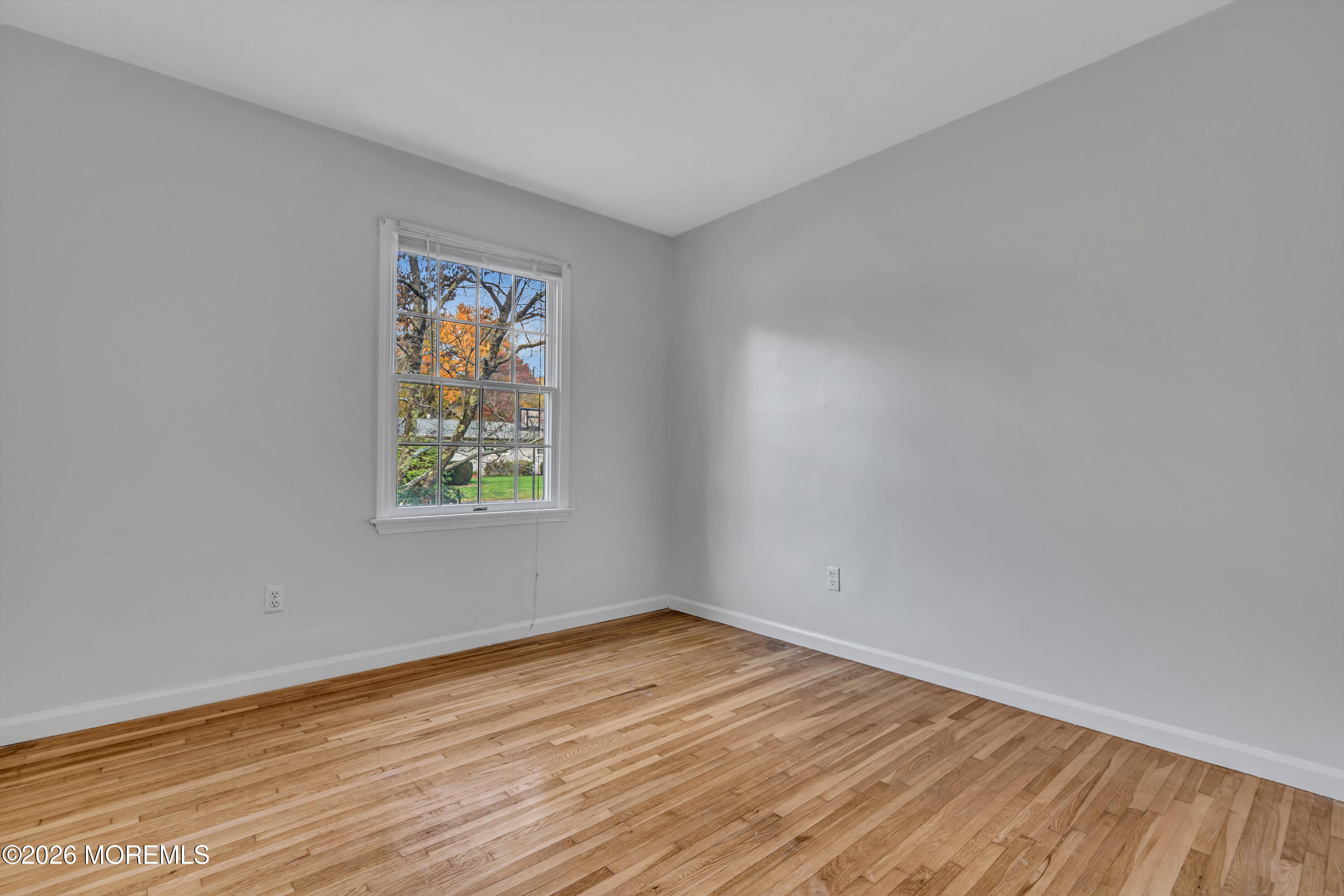 20 Jeanette Street Bayville, NJ 08721 - Photo 18 of 28 wooden floor in an empty room with a window