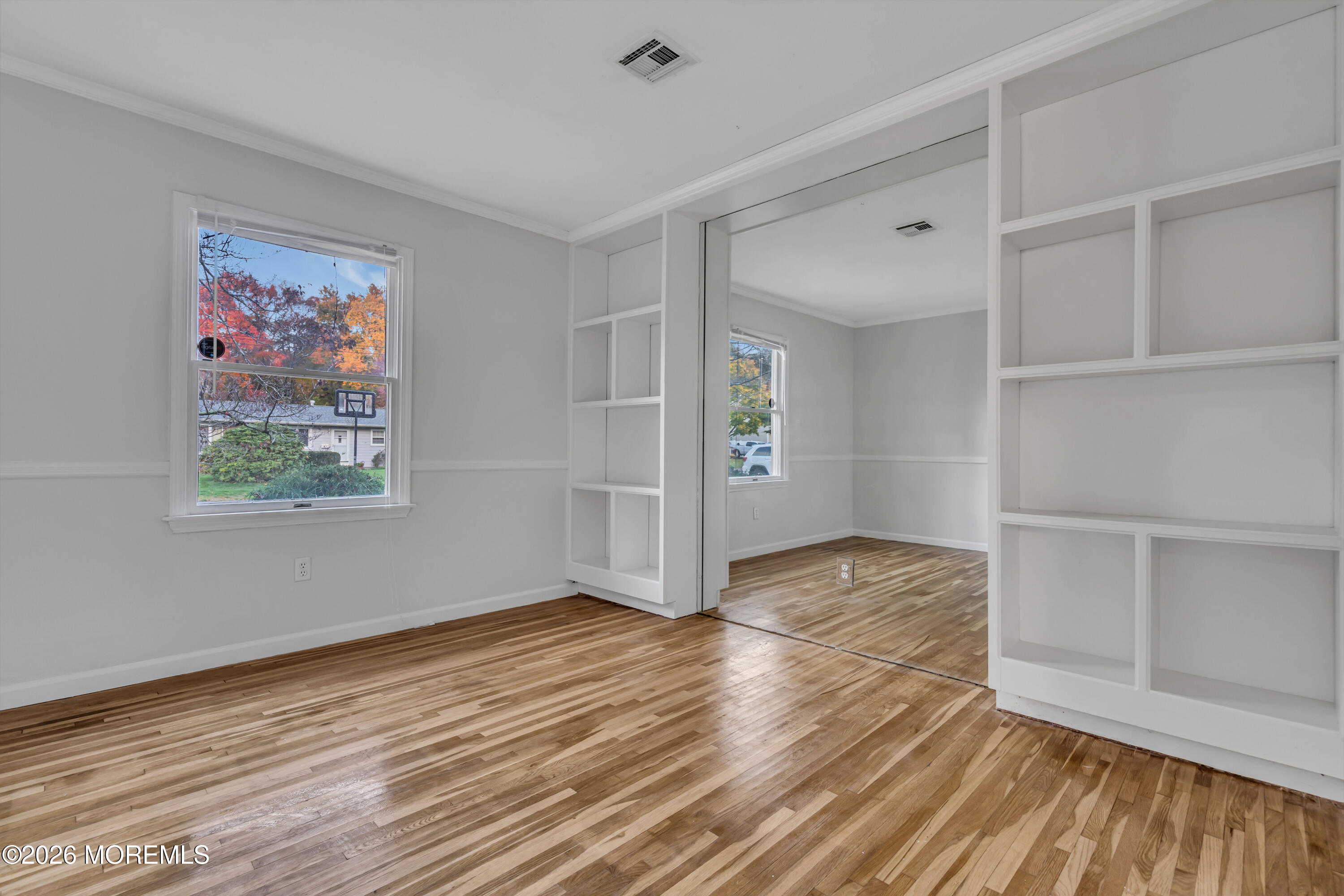 20 Jeanette Street Bayville, NJ 08721 - Photo 19 of 28 a view of empty room with wooden floor and fan