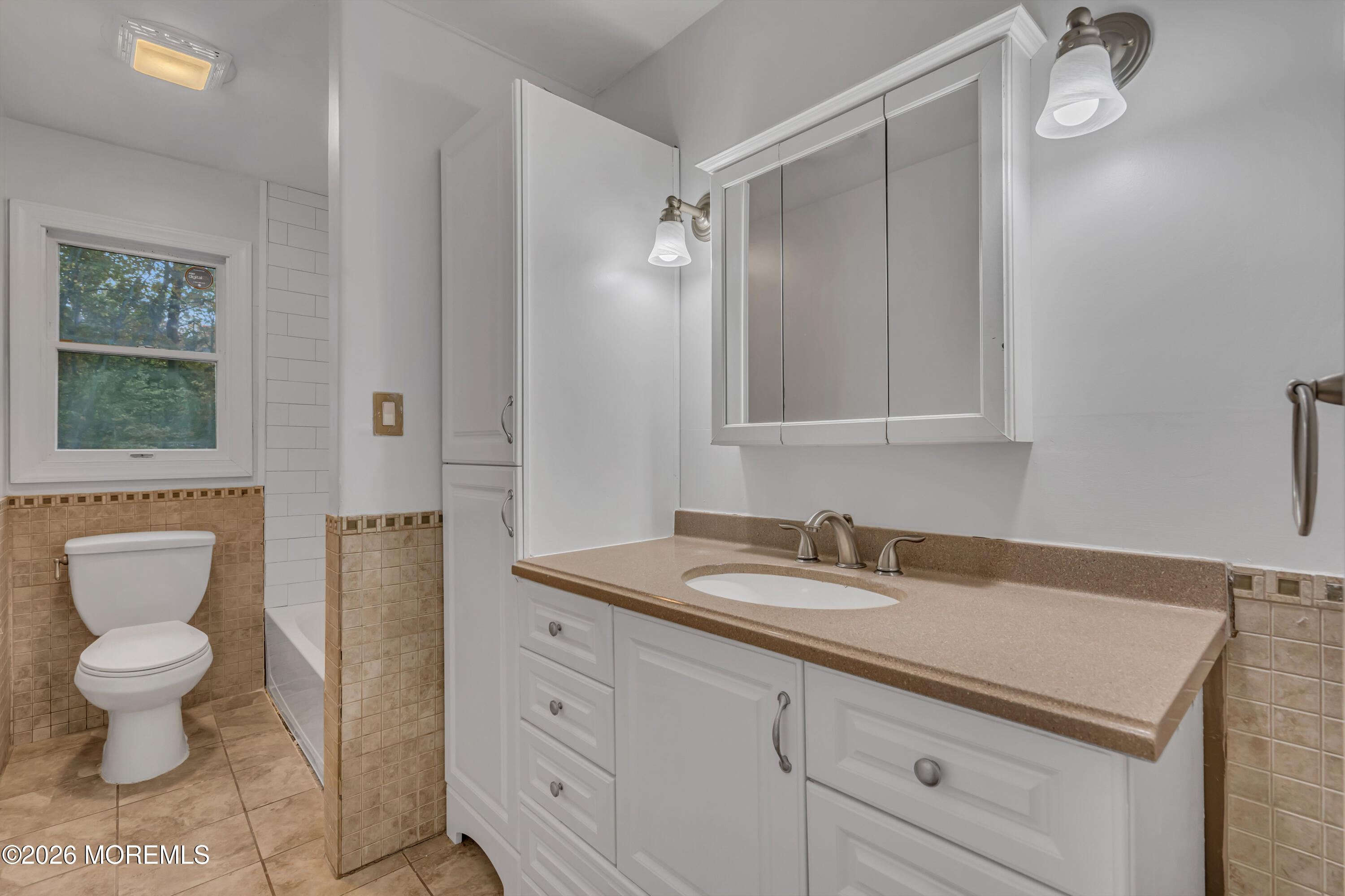 20 Jeanette Street Bayville, NJ 08721 - Photo 22 of 28 a bathroom with a granite countertop sink a toilet and a mirror