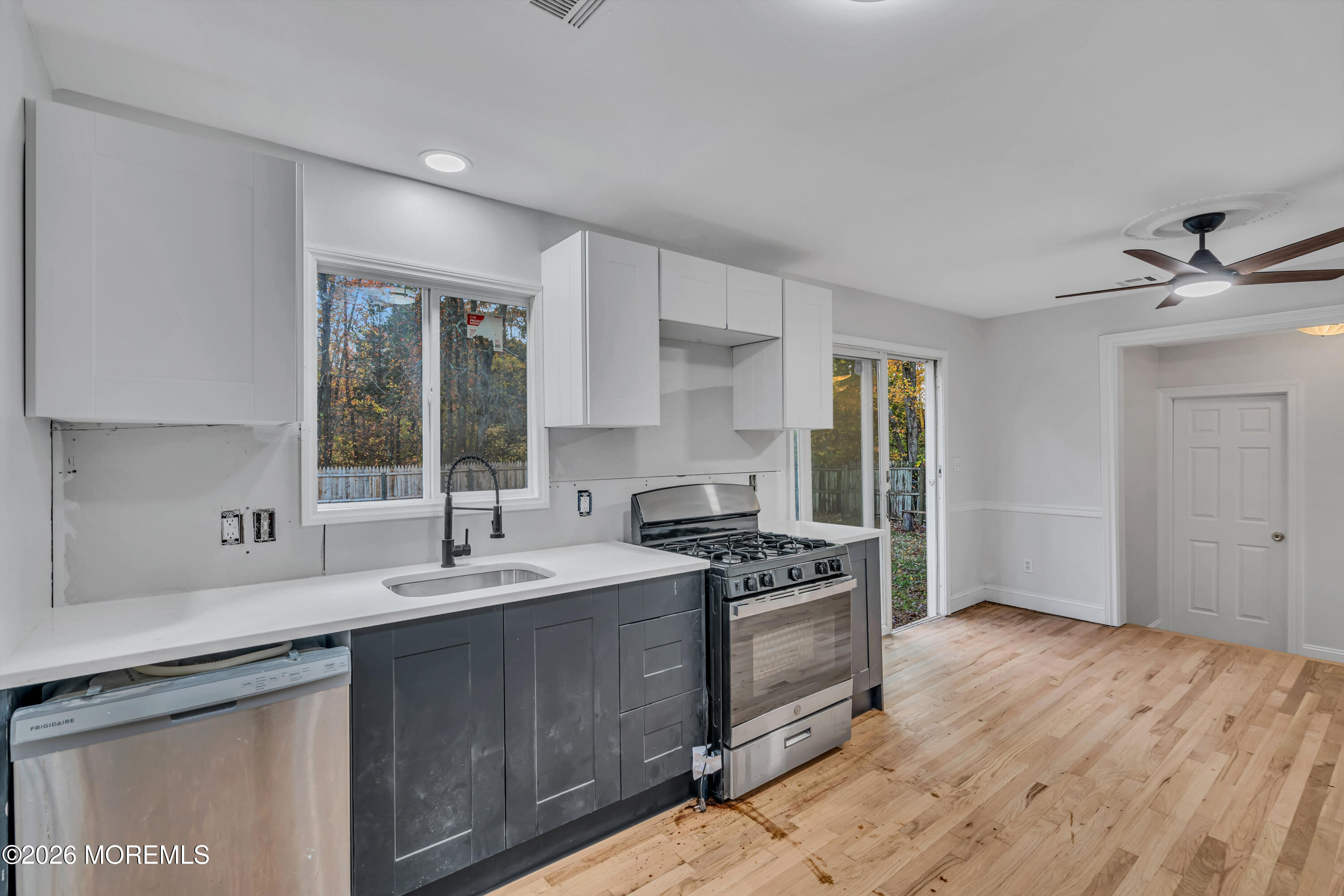 20 Jeanette Street Bayville, NJ 08721 - Photo 6 of 28 a kitchen with a sink stove and cabinets