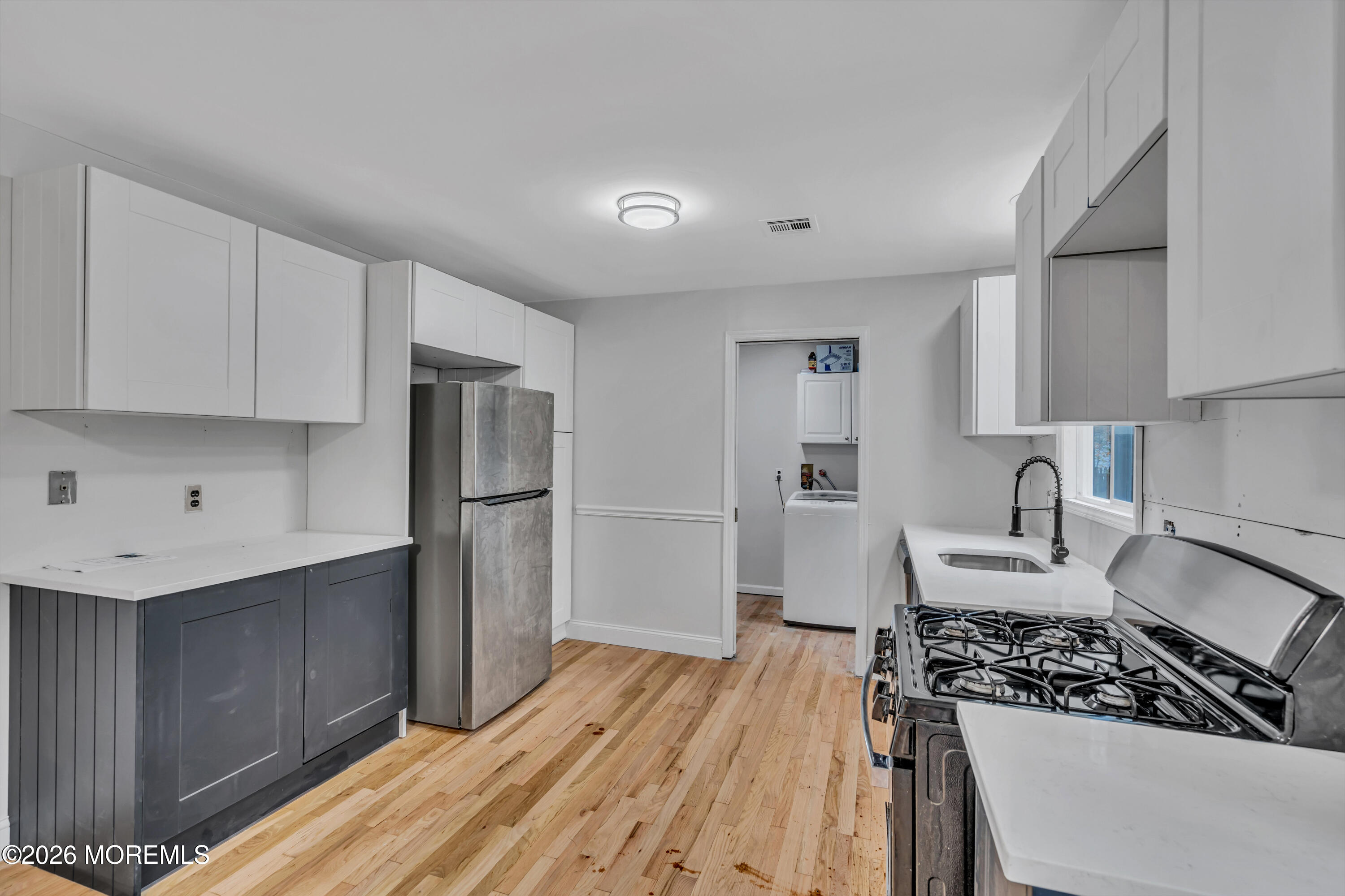 20 Jeanette Street Bayville, NJ 08721 - Photo 8 of 28 a kitchen with granite countertop a stove and a refrigerator