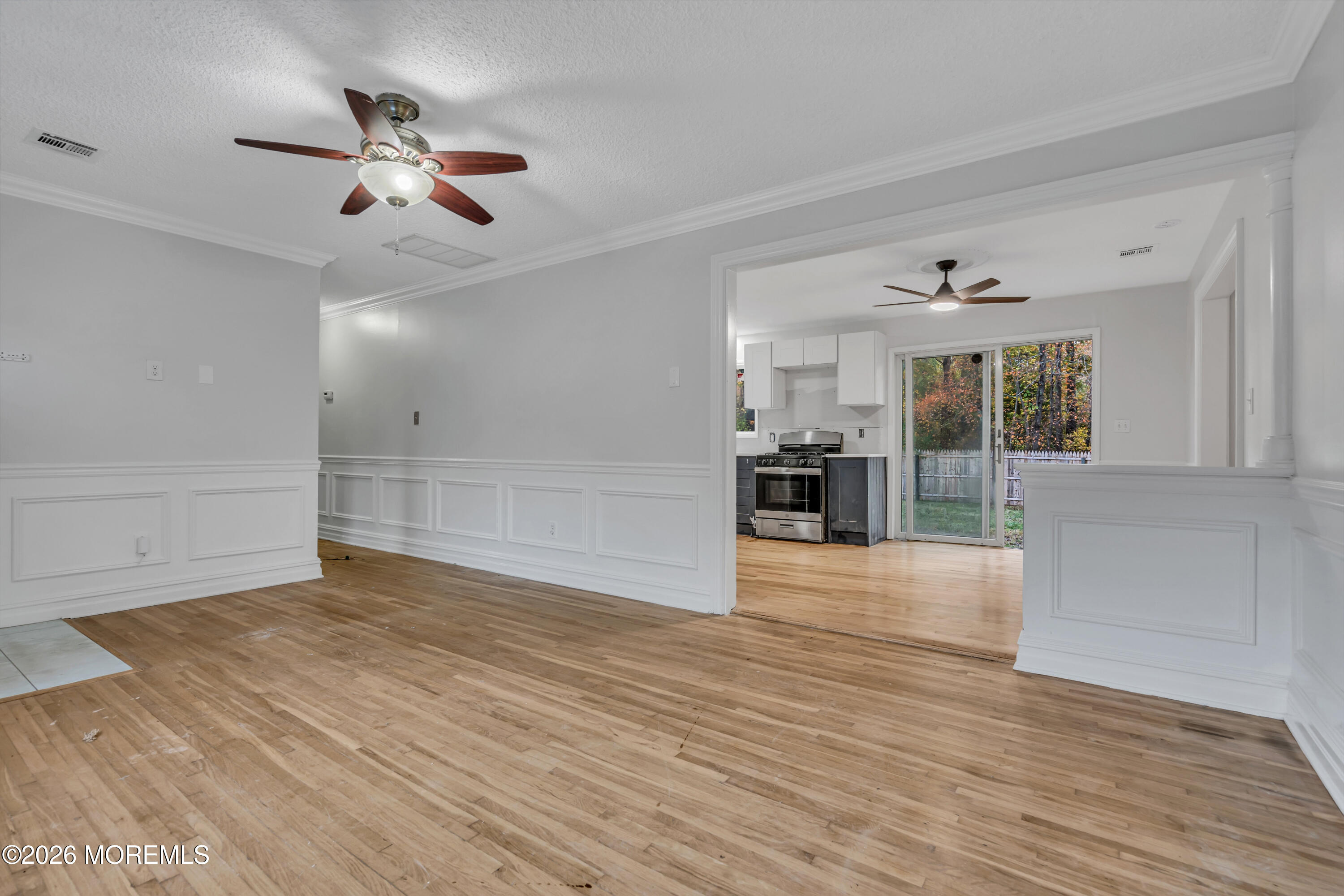 20 Jeanette Street Bayville, NJ 08721 - Photo 9 of 28 a view of empty room with wooden floor and fireplace