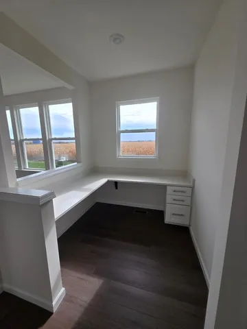 a room with a window and stairs