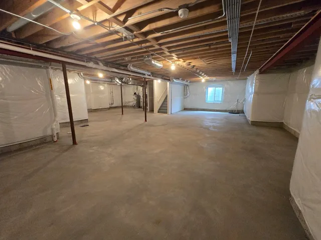 a view of empty room with wooden ceiling