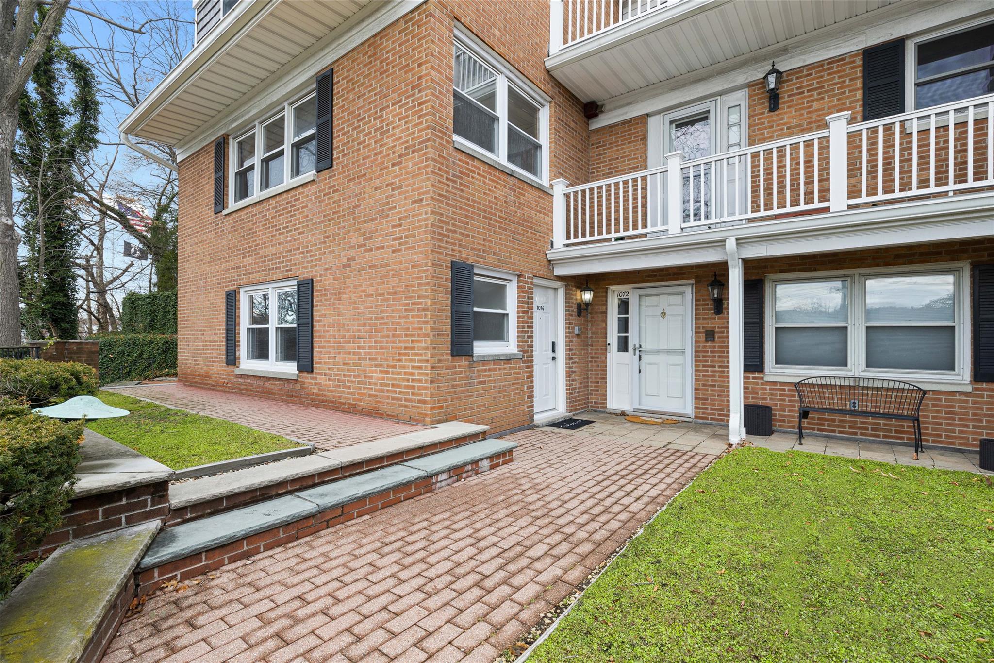 1074 Boston Post Road Rye, NY 10580 - Photo 1 of 1 a front view of a house with garden