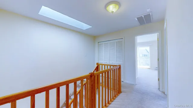 a view of a hallway with front door