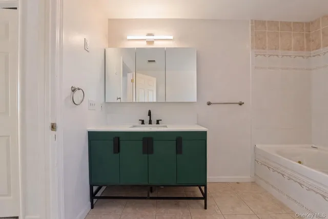 a view of a backyard with sitting area and tub