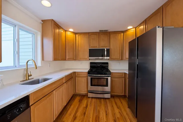 a view of balcony with wooden floor and fence