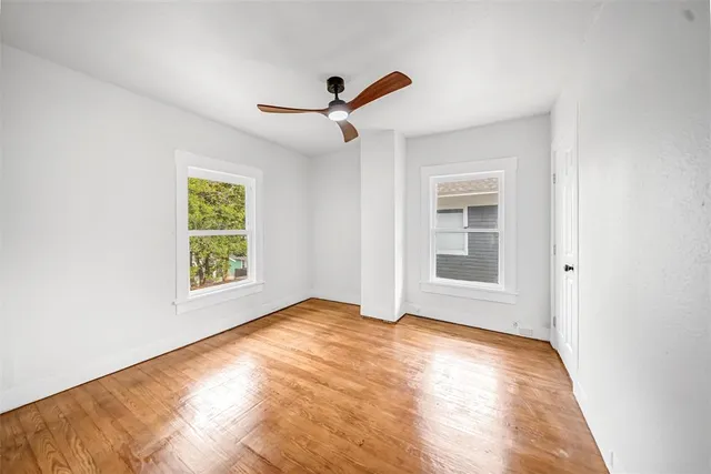 a view of an empty room with a window