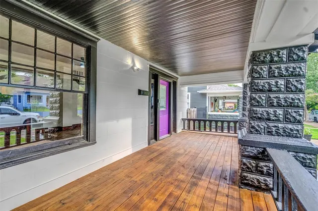 a view of a balcony with furniture