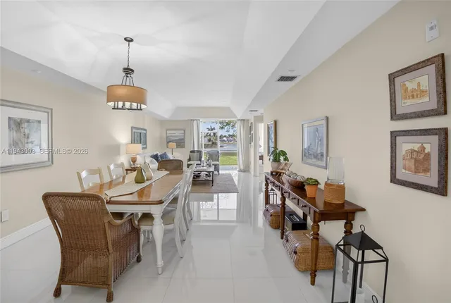 a view of a street with a building and a street sign