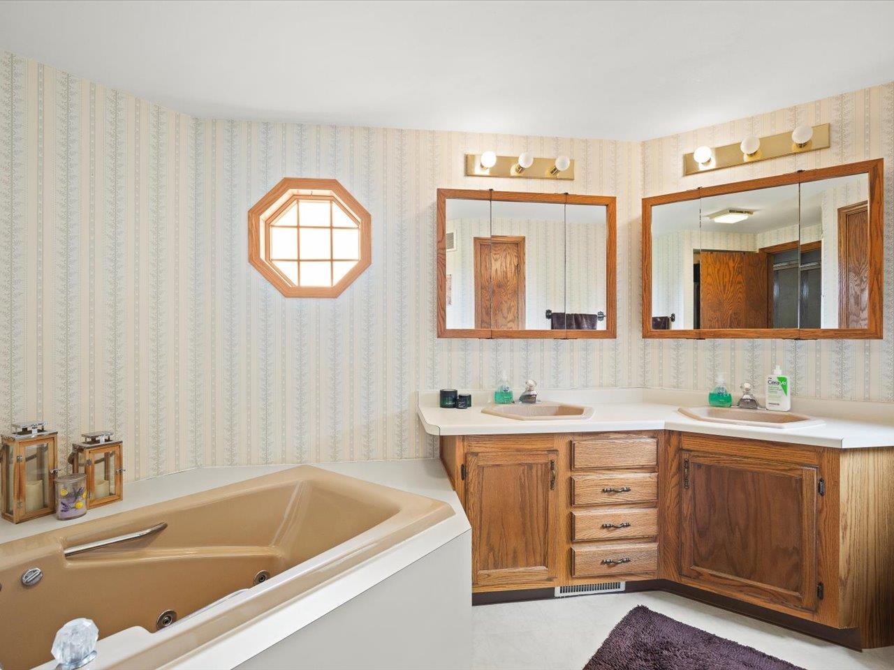 8500 Manchester Road Capron, IL 61012 - Photo 30 of 51 a bathroom with a tub a sink and a mirror