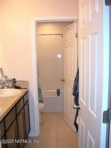 a bathroom with a sink and a shower