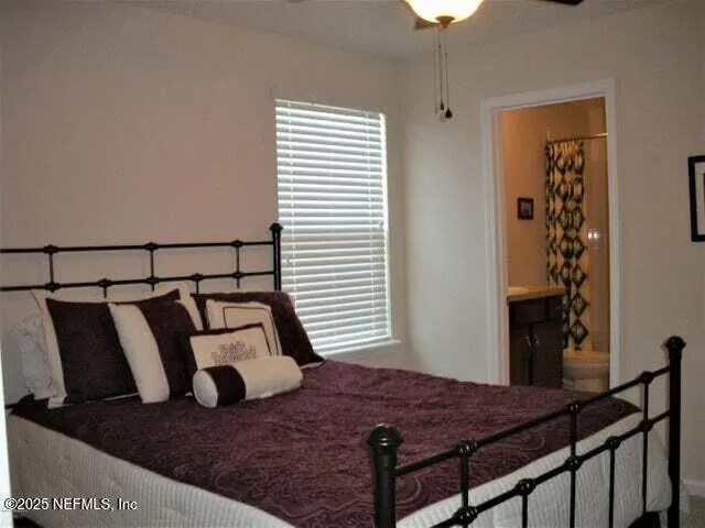 a view of a bedroom and a window