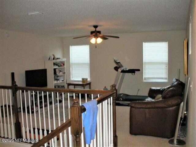 46 Molasses Court Fruit Cove, FL 32259 - Photo 15 of 17 a living room with furniture and a flat screen tv
