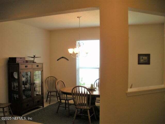 46 Molasses Court Fruit Cove, FL 32259 - Photo 6 of 17 a view of a dining room with furniture